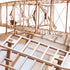 Détails maquette Wright Flyer puzzle 3D, gros plan moteur hélices haubans et structure ailes nervures découpe laser précise